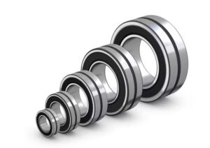 A photo of a series of sealed roller bearings against a white background. They're lined up from smallest to largest.