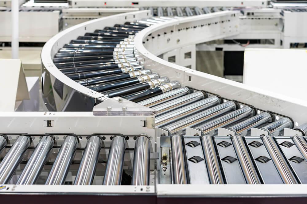 conveyor system with rollers and a diverter for different paths